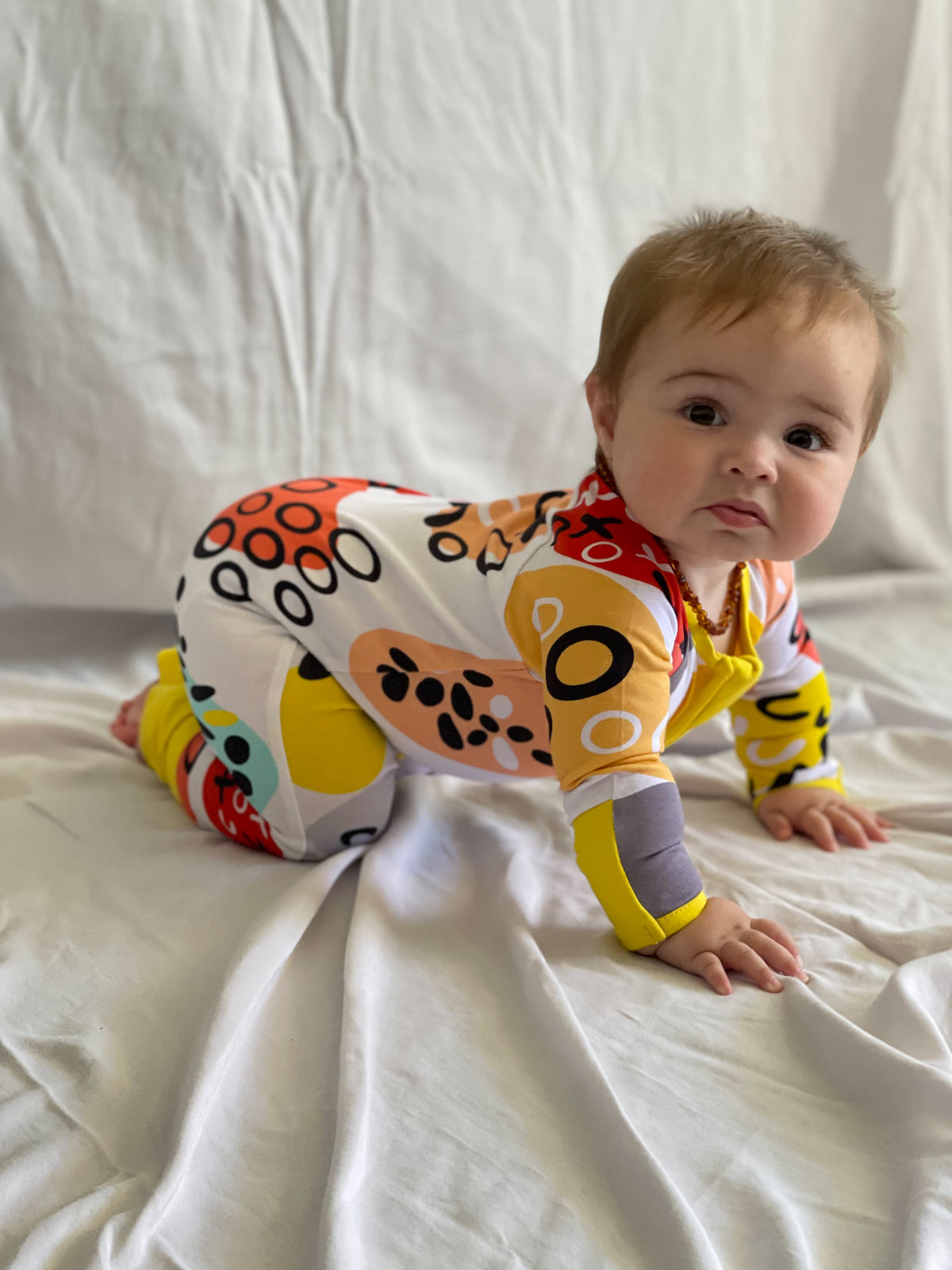 Pebbles Print Onesie with Dandelion Trim