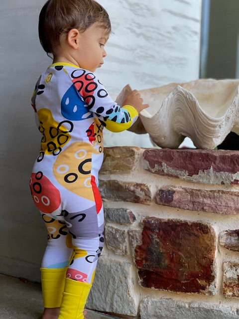 Pebbles Print Onesie with Dandelion Trim