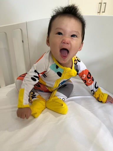Pebbles Print Onesie with Dandelion Trim