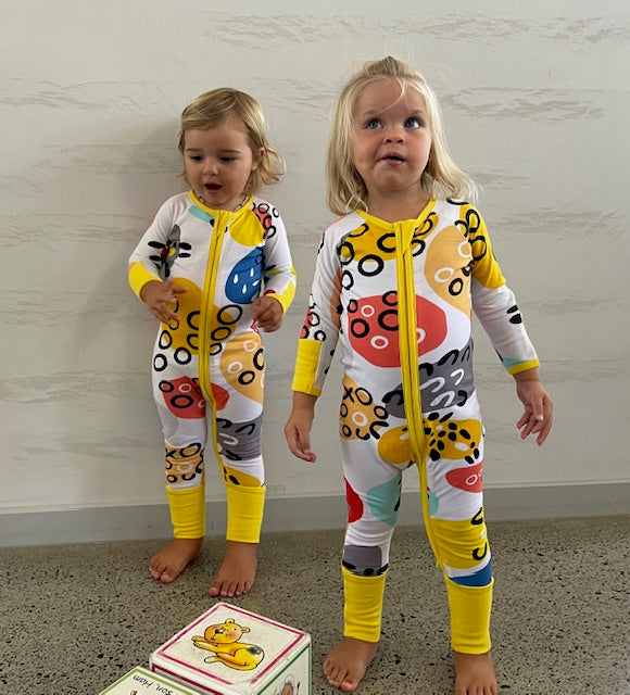 Pebbles Print Onesie with Dandelion Trim