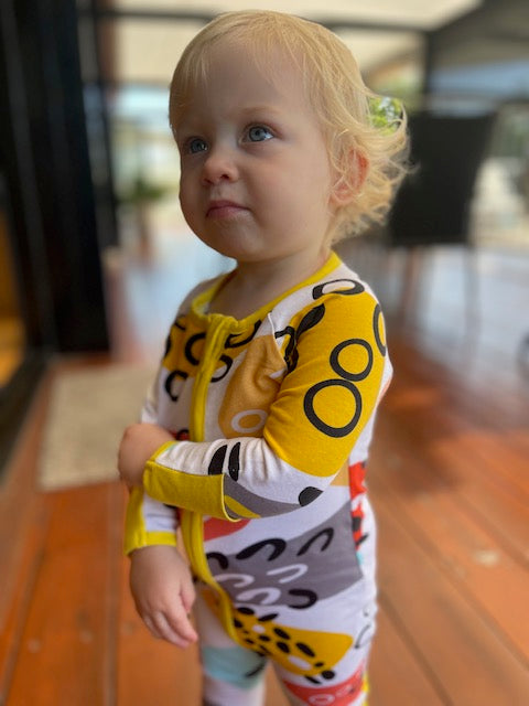 Pebbles Print Onesie with Dandelion Trim